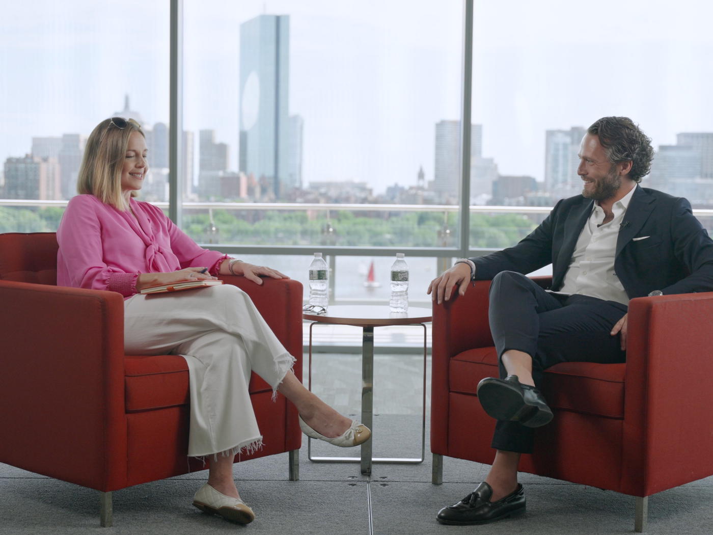 Fiona Murray and Raafat Azzouz sit facing each other and chatting