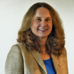 Profressional headshot of woman in a suit